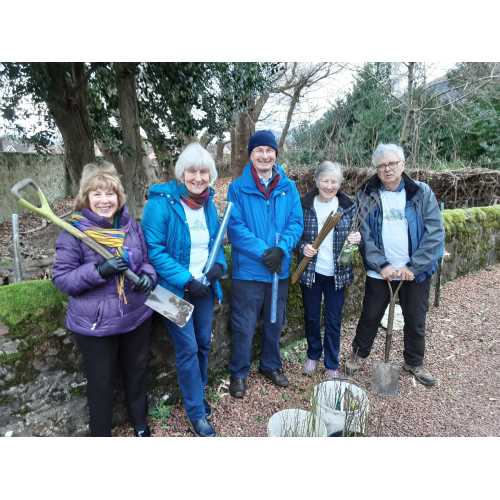 Ian Young and the ladies of Tillicoultry Parish Church planting a variety of trees and bushes