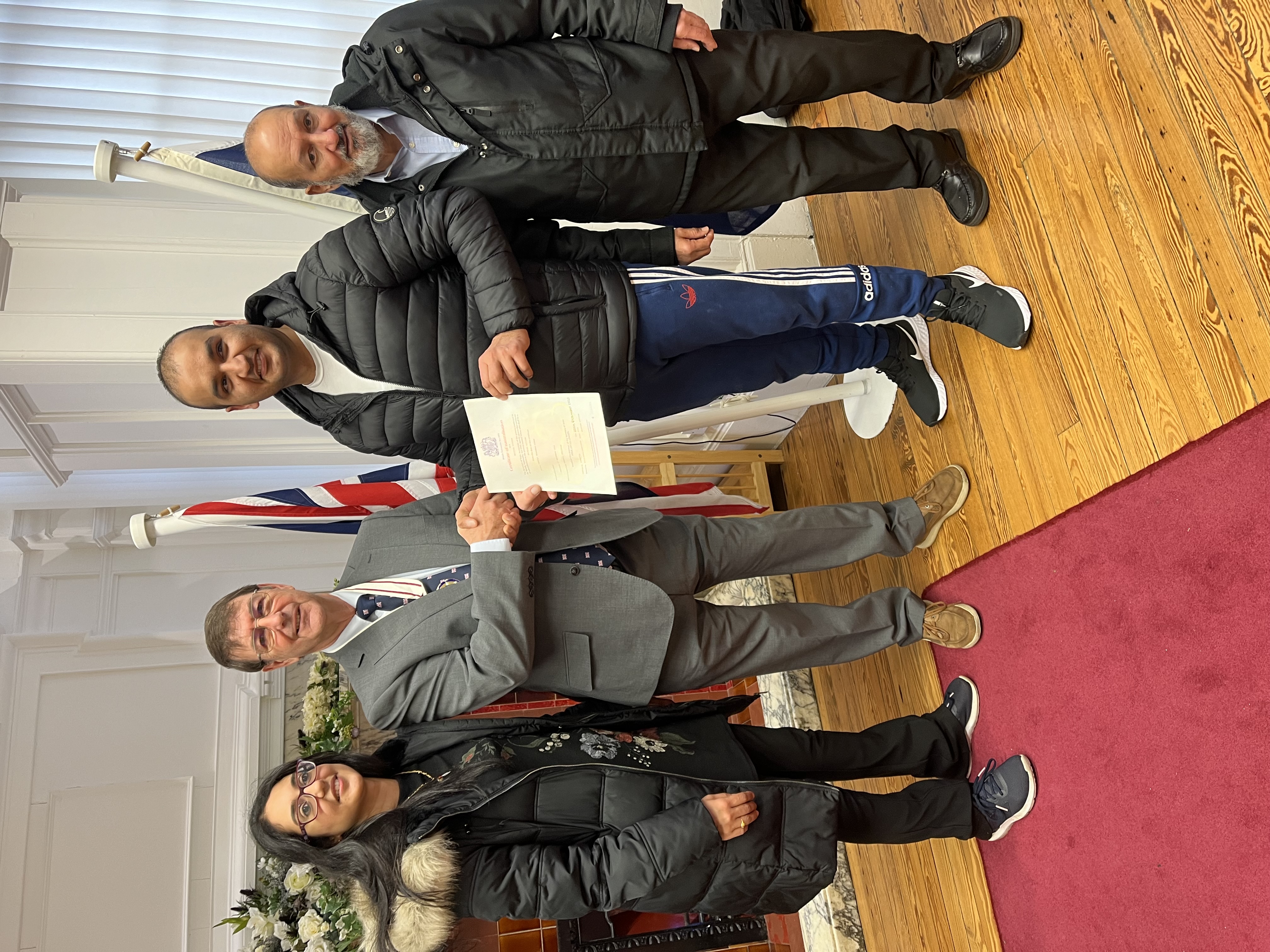 Muhammad with family receiving his Naturalisation Certificate